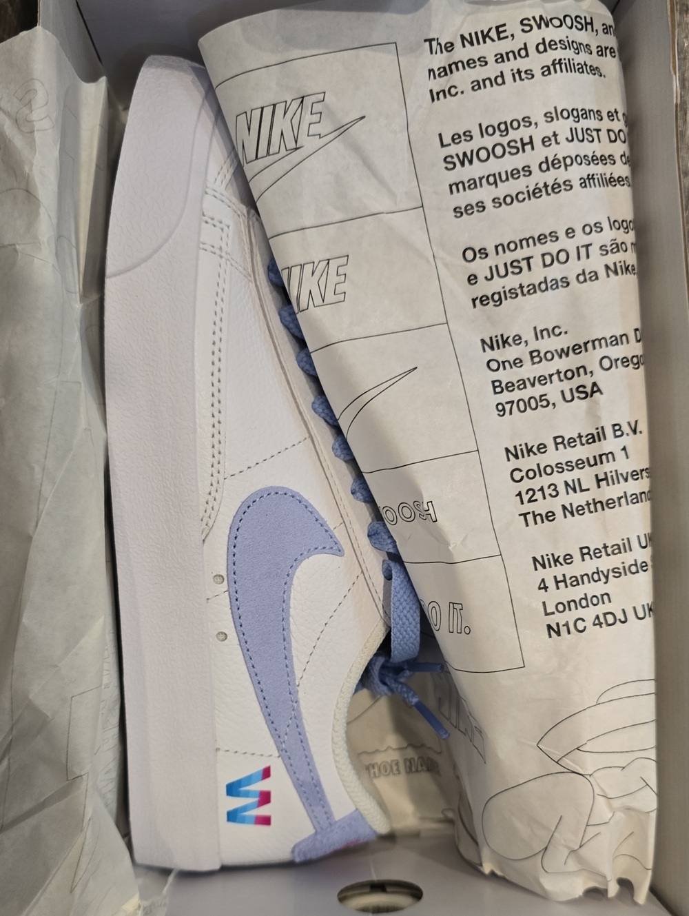 Nike White Sneaker with Pastel Purple Swoosh